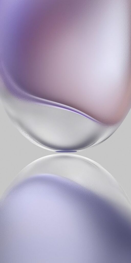 Abstract purple and pink gradient spheres with soft highlights on a light gray background.
