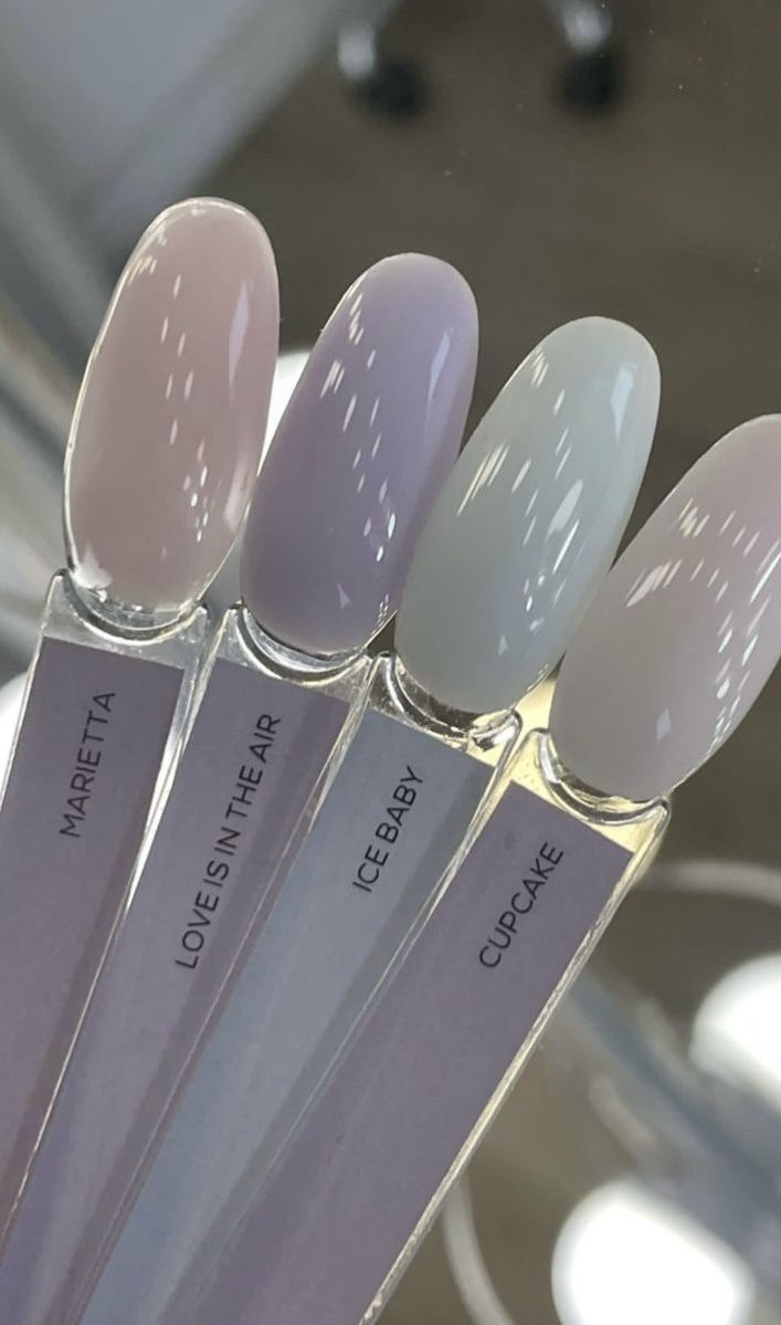 Pastel nail polish samples labeled Marietta, Love Is In The Air, Ice Baby, Cupcake, arranged in a fan display.
