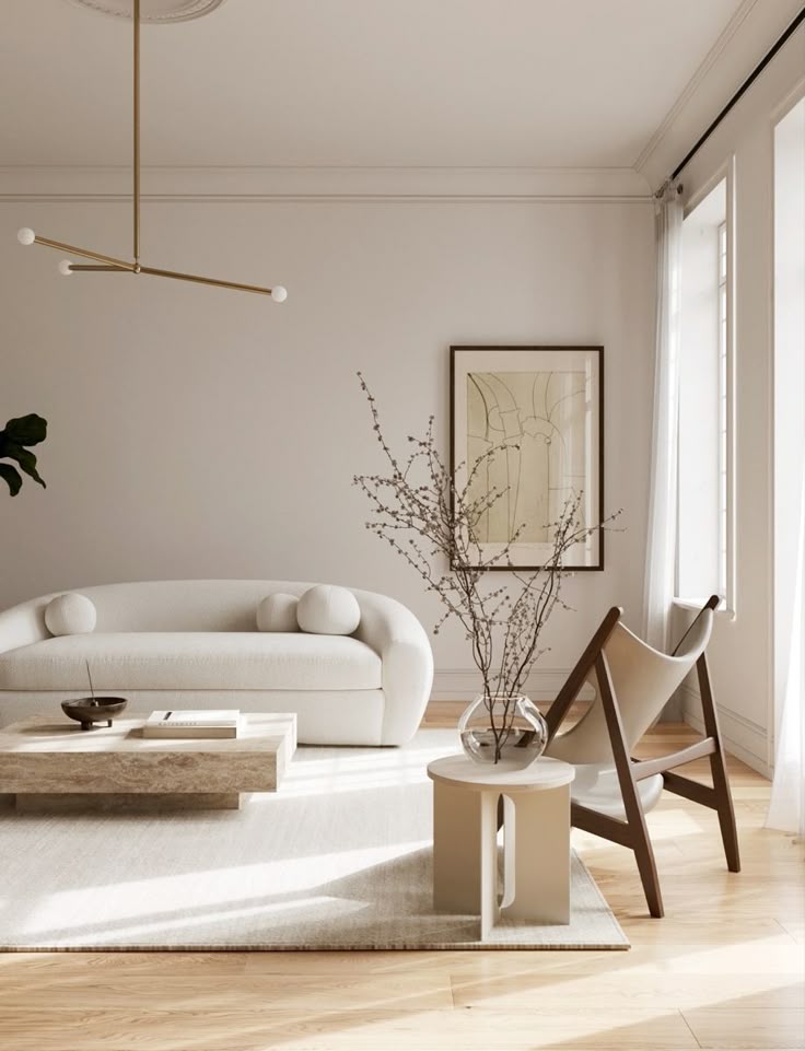 Minimalist living room with modern furniture, soft lighting, and neutral tones. Cozy sofa, wooden chair, and elegant decor.
