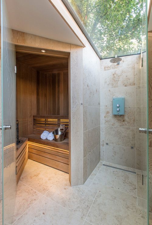 5c9603c07f569b8fdeffc7bd28e59198 Modern spa room with a wooden sauna and adjacent stone-tiled shower under a skylight, creating a relaxing ambiance. | Sky Rye Design Modern spa room with a wooden sauna and adjacent stone-tiled shower under a skylight, creating a relaxing ambiance.