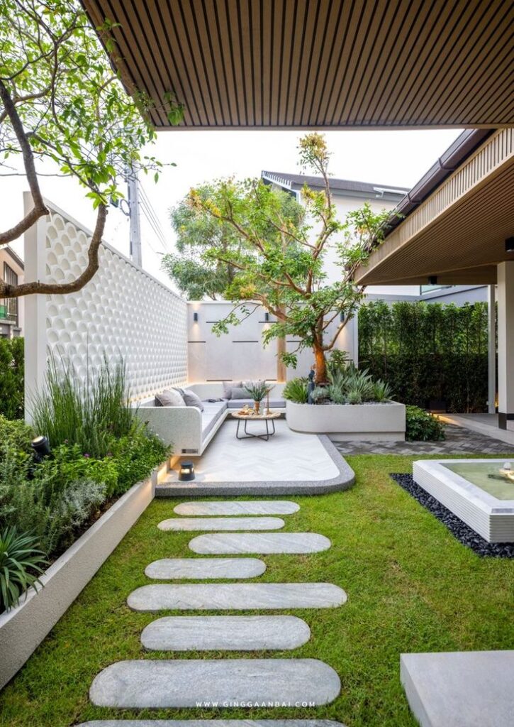 6265c7807802e926d4315f87cf18fd1e Modern outdoor garden with seating, tree, and stone path, offering a serene space for relaxation and gatherings. | Sky Rye Design Modern outdoor garden with seating, tree, and stone path, offering a serene space for relaxation and gatherings.