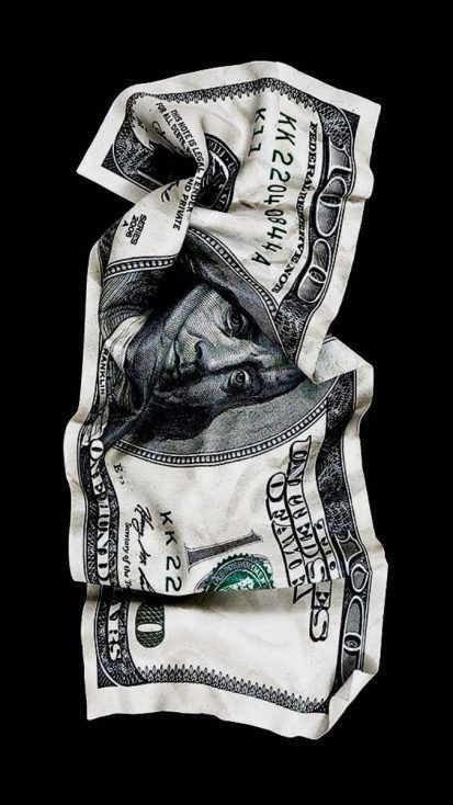 Crumpled USD hundred-dollar bill on a black background, showcasing Benjamin Franklin's portrait prominently.