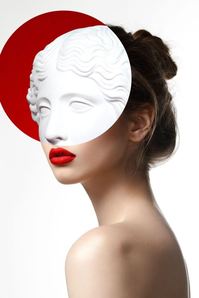 Woman with red lips and an artistic white mask on her face, against a red circle background.