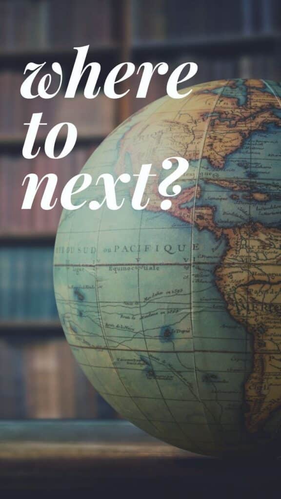 Vintage globe with Where to next? text, symbolizing travel and exploration decisions.