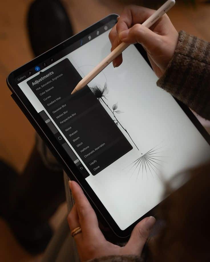 Person using a stylus to draw on a tablet with design adjustments menu open.
