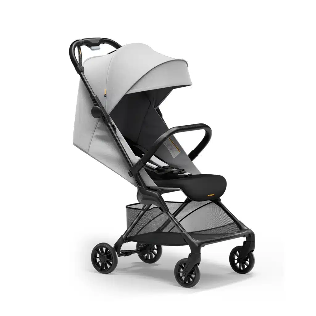 Compact gray baby stroller with a canopy and mesh storage basket, designed for mobility and comfort.