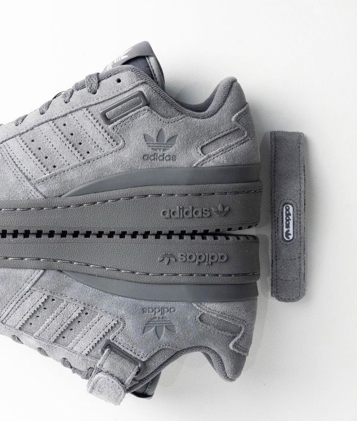Gray Adidas sneakers with Velcro design, photographed from the side on a white background.