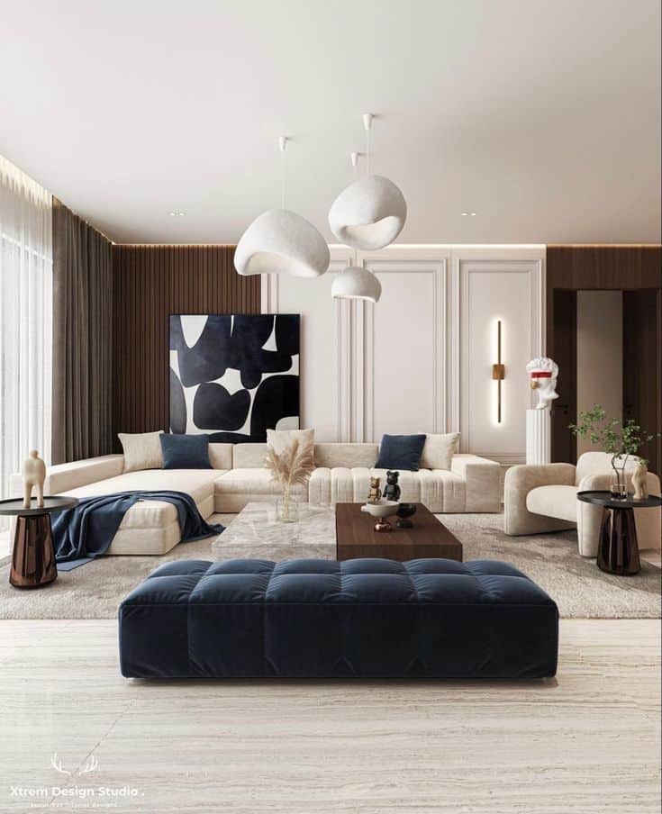 Modern living room with abstract art, elegant furniture, and stylish lighting fixtures.