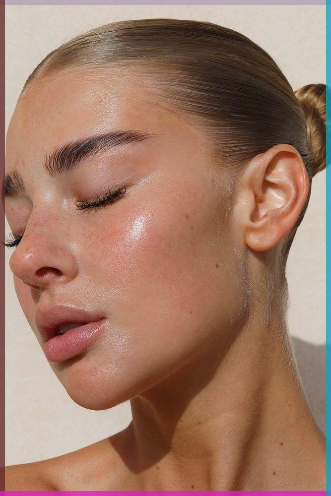 Close-up of a woman with glowing skin, eyes closed, showcasing natural beauty and radiant complexion.