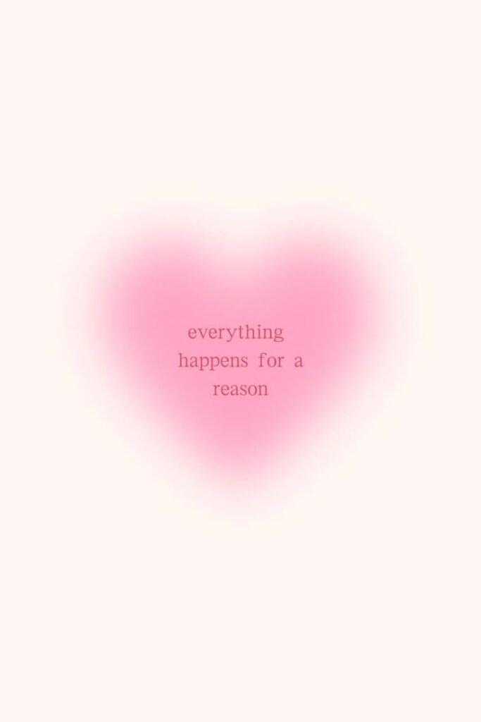 Pink heart with everything happens for a reason written inside, set against a light background for a positive message.