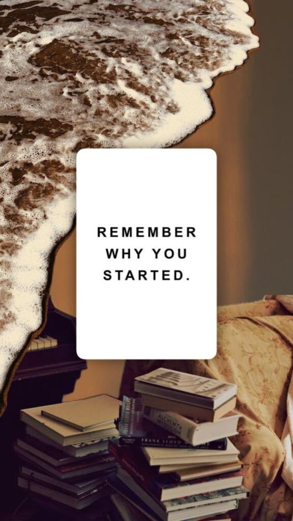 Inspirational quote with books and ocean: Remember why you started. Motivational text overlay.