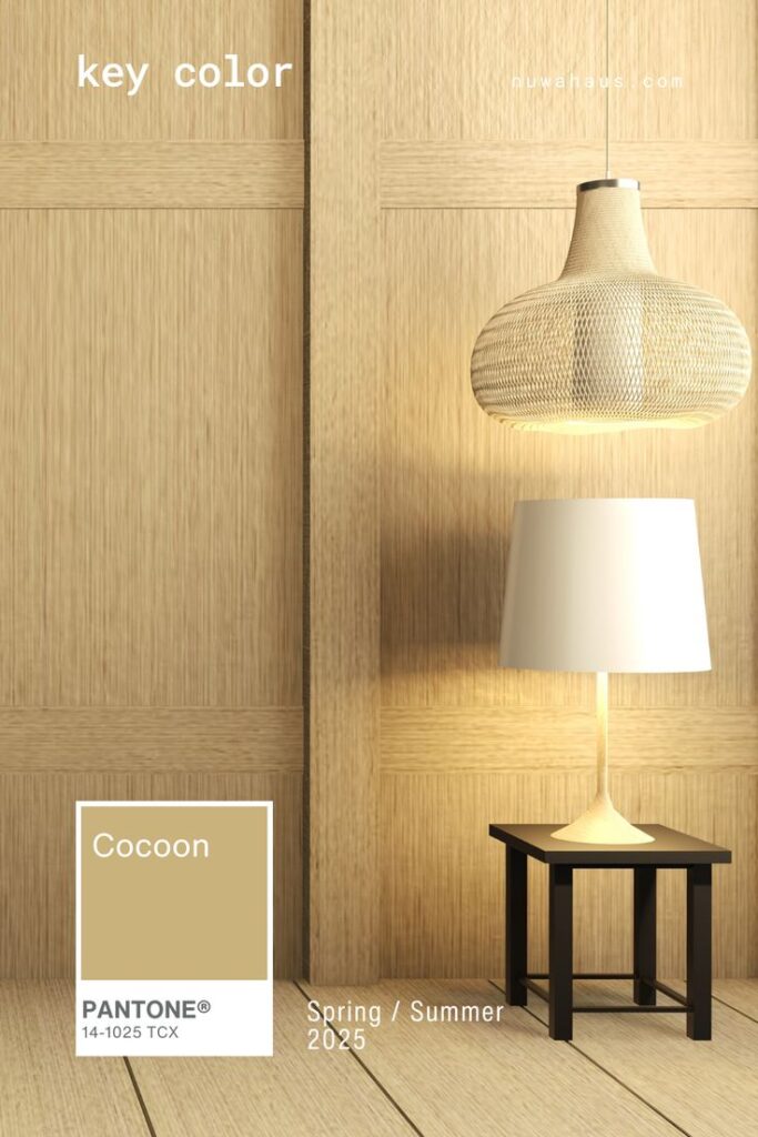 Modern interior with wood panels, featuring Cocoon Pantone color, pendant light, and table lamp for Spring/Summer 2025.