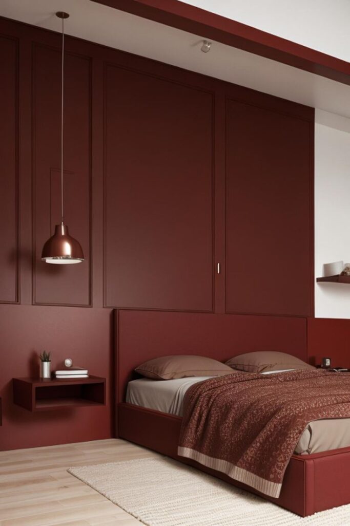 Modern bedroom with burgundy walls, hanging lamp, cozy bed, and minimalist decor for chic home design.