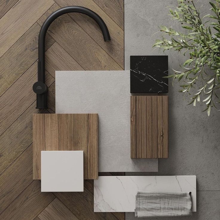Modern kitchen design layout with wood and marble samples, matte black faucet, and greenery on herringbone flooring.