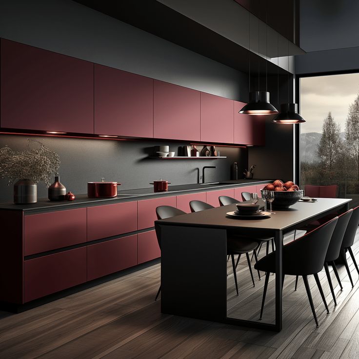 Modern kitchen with sleek dark red cabinets, black countertops, and elegant lighting, overlooking scenic treetops.