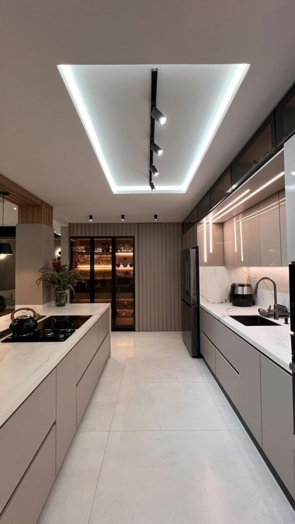 Sleek modern kitchen with minimalist design, marble countertops, track lighting, and stylish cabinetry.