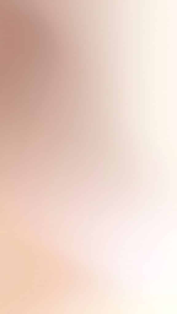 Abstract soft gradient of beige and light brown tones, creating a smooth and calming background texture.
