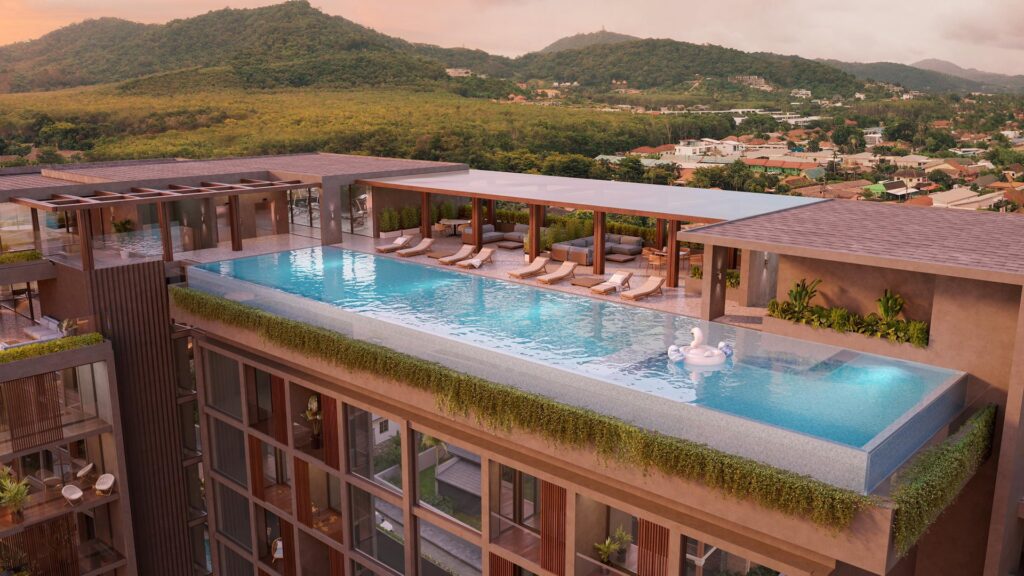 Luxury rooftop infinity pool with swan float, overlooking lush green hills and cityscape.