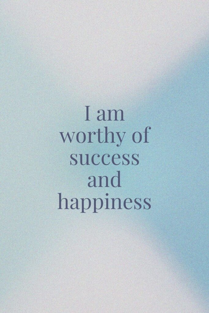 Inspirational quote: I am worthy of success and happiness on a soft blue background.