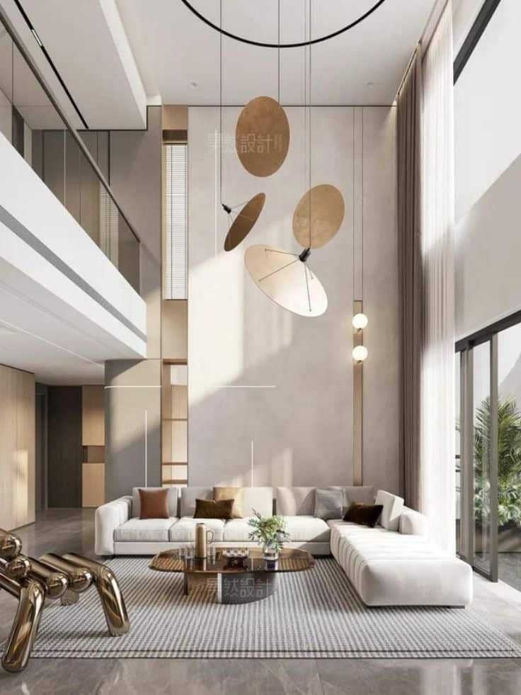 House inspiration Modern living room with high ceilings, stylish pendant lights, white sectional sofa, and large windows. | Sky Rye Design Modern living room with high ceilings, stylish pendant lights, white sectional sofa, and large windows.