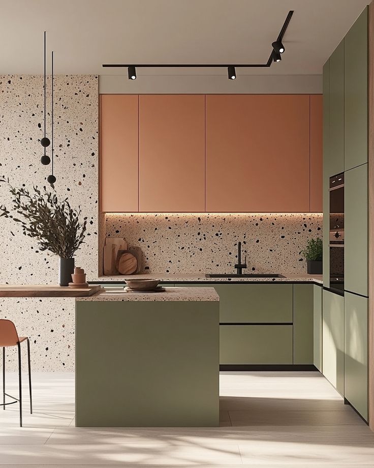How to Create a Minimalist Kitchen with a Splash of Color 🎨✨ Youll Love These Design Ideas Modern kitchen with green cabinets, terrazzo countertops, and track lighting for a chic, minimalist design. | Sky Rye Design Modern kitchen with green cabinets, terrazzo countertops, and track lighting for a chic, minimalist design.