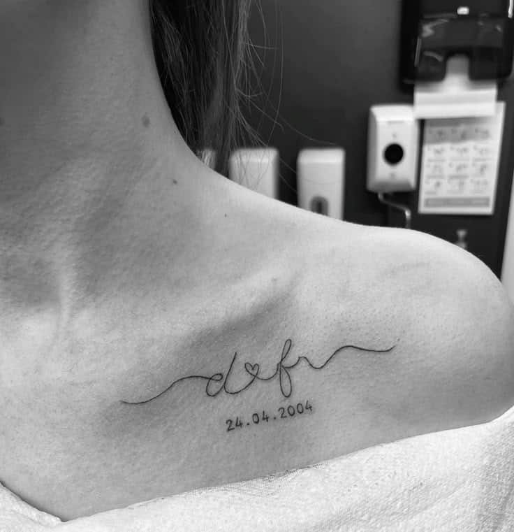 Minimalist collarbone tattoo with initials and date, d, f, heart, r and 24.04.2004, in a modern script font.