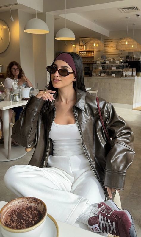 Leather Jacket Women Faux Oversized Motorcycle Trendy woman in cafe wearing sunglasses and leather jacket, sipping coffee, stylish casual outfit. | Sky Rye Design Trendy woman in cafe wearing sunglasses and leather jacket, sipping coffee, stylish casual outfit.