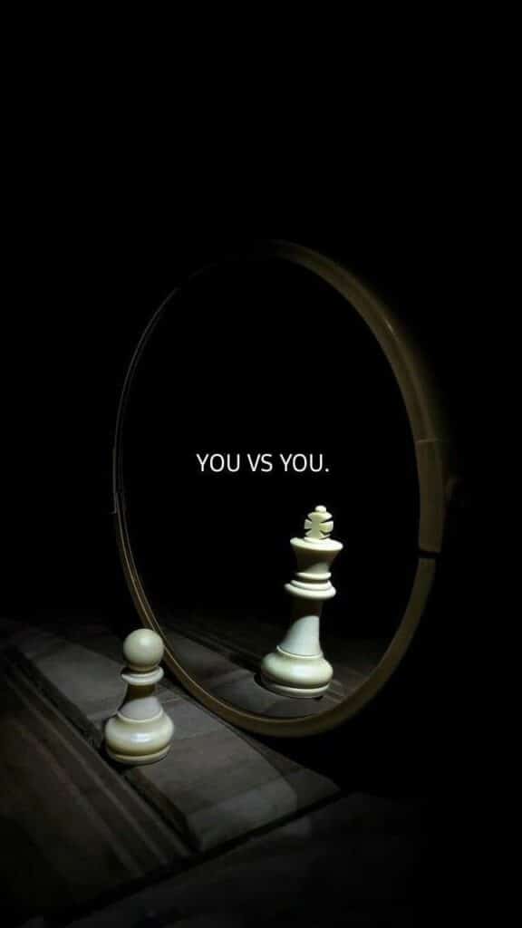 Chess pawn reflection as a king in a mirror with You vs You text, symbolizing self-improvement and personal growth.