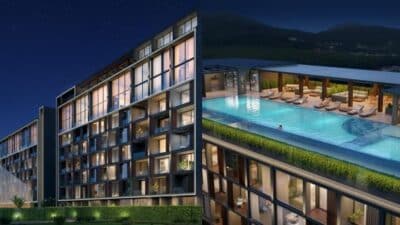 Modern building facade and rooftop pool at night, showcasing luxury urban lifestyle and architecture.