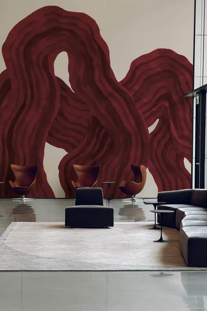 Modern lobby with abstract red mural, elegant chairs, and sleek decor. Contemporary interior design. Burgundy Pantone Style