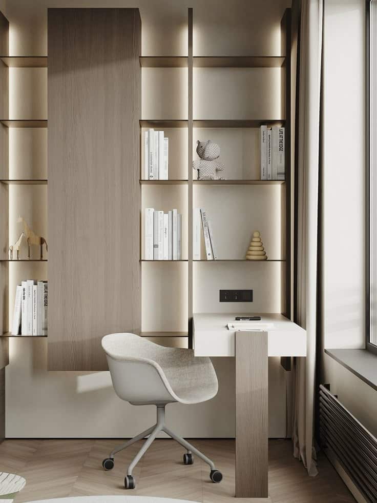 Modern minimalist home office with wooden shelves, books, a small desk, and a beige swivel chair by a window.