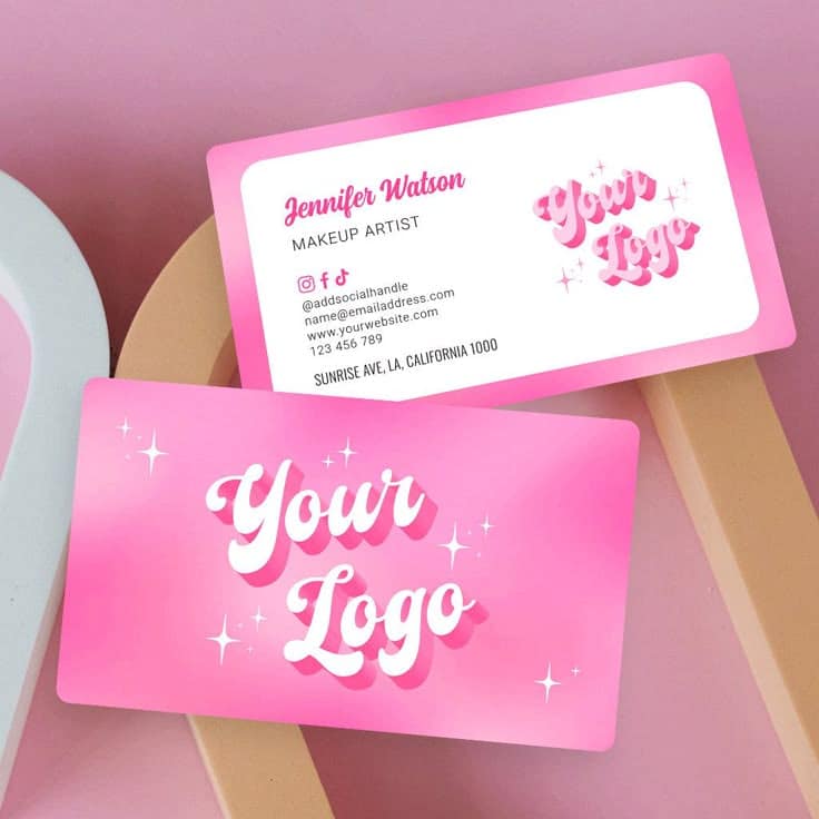 Pink business card mockup for makeup artist with logo space and social media handles on a stylish background.
