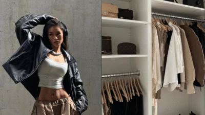 Fashionable woman in a leather jacket posing next to an organized minimalist wardrobe.