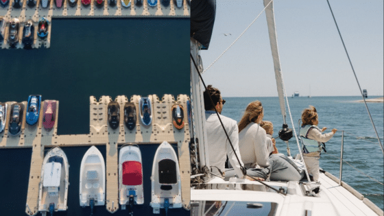 Viewing Deck Blog 14 Yachts docked at marina and family sailing on a boat enjoying ocean view under sunny skies. | Sky Rye Design Yachts docked at marina and family sailing on a boat enjoying ocean view under sunny skies.