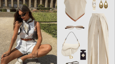 Fashionable woman in white summer outfit with accessories: sunglasses, scarf, bag, and earrings, in a garden setting.