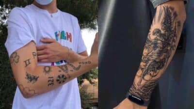 Two arms with diverse tattoos, including symbols and intricate designs, showcasing unique personal styles.