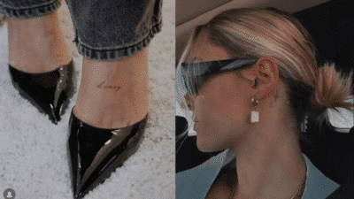 Trendy fashion details: black pointed heels, minimal honey tattoo, chic hairstyle, stylish sunglasses, gold earrings.