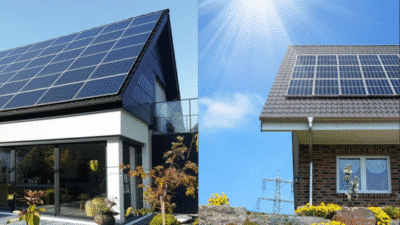 Modern homes with solar panels, sunny sky, sustainable energy solutions.