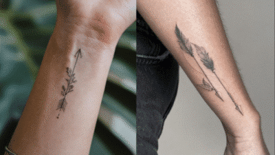 Minimalist arrow tattoos on forearms featuring nature-inspired designs, showcasing creativity and artistry in body art.