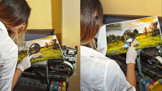 Viewing Deck Blog 9 Person inspecting photo print quality with magnifying glass beside a printer. Printing process assessment. | Sky Rye Design Person inspecting photo print quality with magnifying glass beside a printer. Printing process assessment.