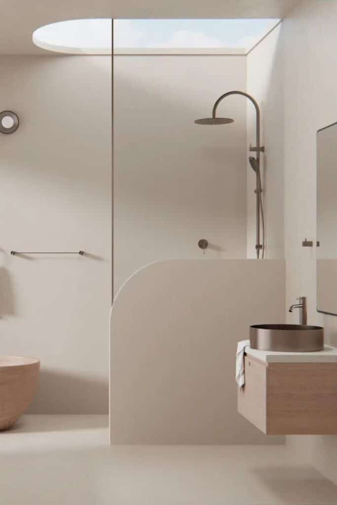 Minimalist beige bathroom with modern skylight, rainfall shower, and sleek vanity.