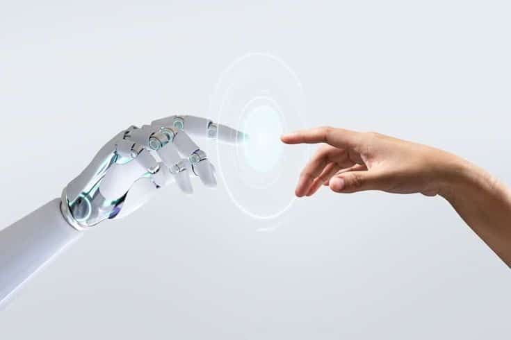 Robot and human hands reaching towards each other, symbolizing technology and human connection.