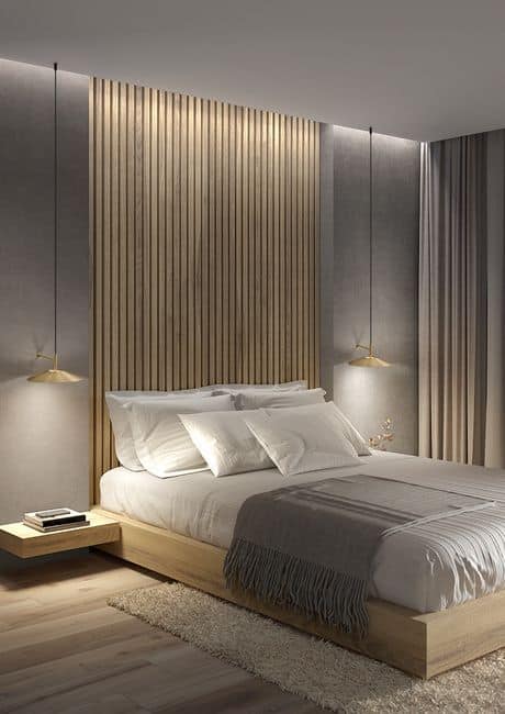 Modern bedroom with wooden accent wall, cozy bed, ambient lighting, and minimalist decor.