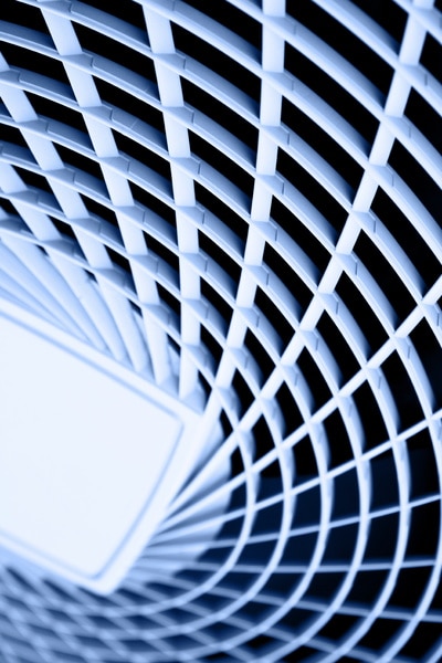 Abstract view of a geometric grid pattern, creating a striking visual effect in blue tones.