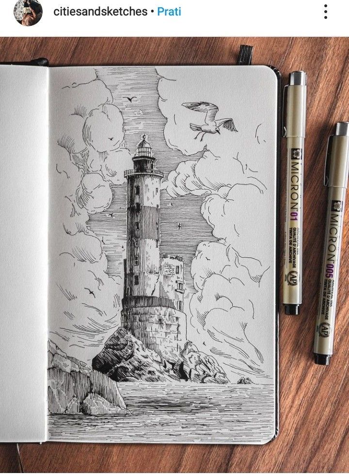 Ink sketch of a lighthouse on a rocky shore, surrounded by clouds and seagulls, with pens and notebook on a wooden table.