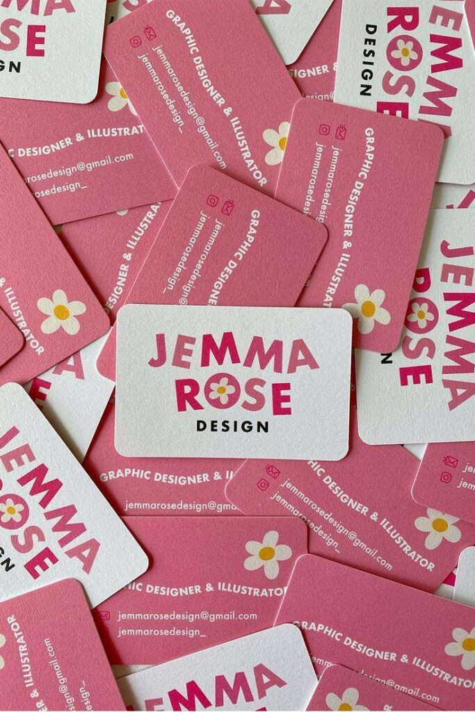 Creative graphic design business cards with pink floral theme.