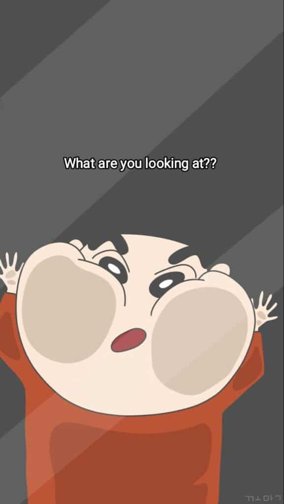 Cartoon character with large cheeks asking What are you looking at? in a humorous, puzzled expression.