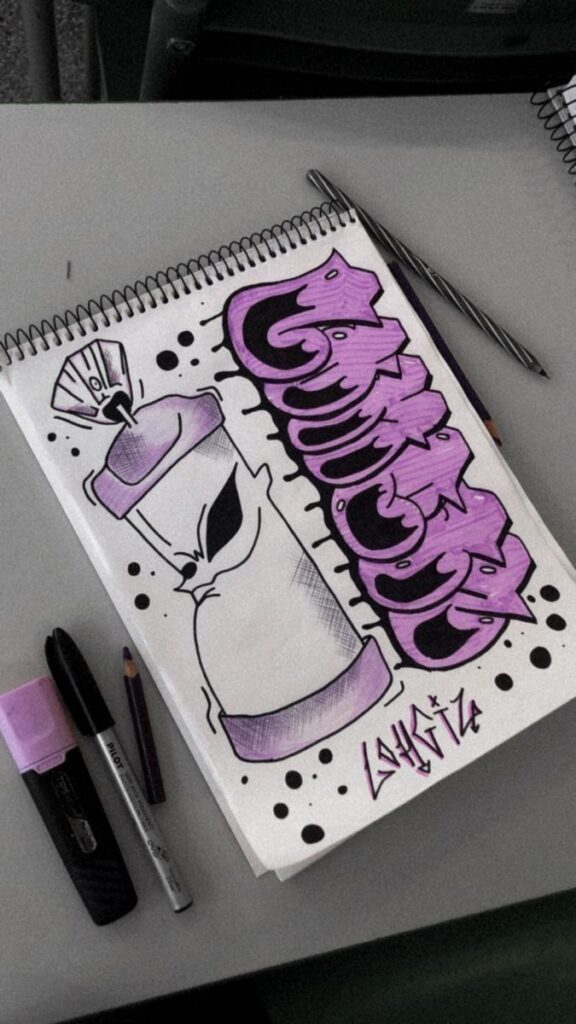 Graffiti-inspired sketch with purple and black markers on a spiral notebook, featuring abstract graphics and an alien.