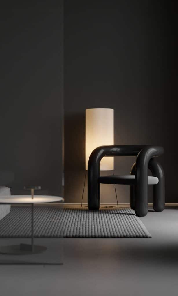 Modern dark living room with a sleek black chair, cozy area rug, and warm floor lamp.