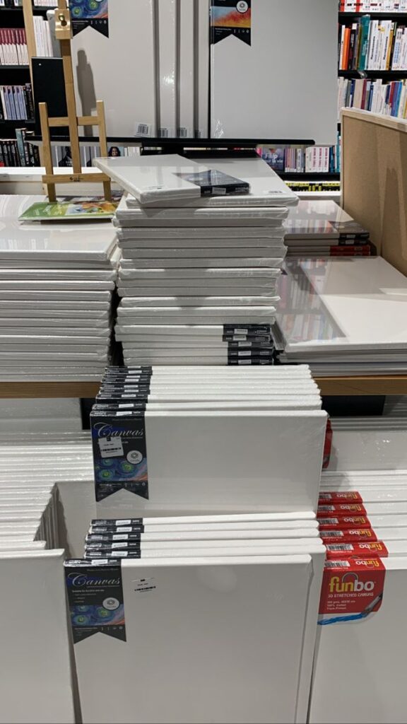 ceac1e24-1213-46f3-b9c4-1ff14a37e3d2 Stacks of blank canvases in an art store, ready for painting projects and creative endeavors. | Sky Rye Design Stacks of blank canvases in an art store, ready for painting projects and creative endeavors.
